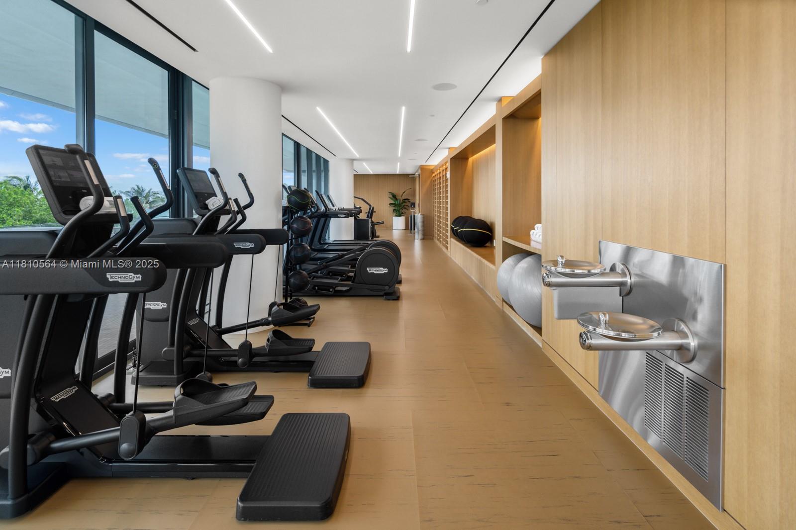 8701 Collins Avenue, Unit 905 Miami Beach, FL 33154 - Photo 60 of 80 a room with gym equipment and a large window