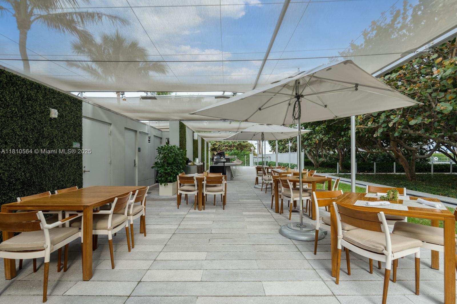 8701 Collins Avenue, Unit 905 Miami Beach, FL 33154 - Photo 64 of 80 an outdoor space with swimming pool and patio