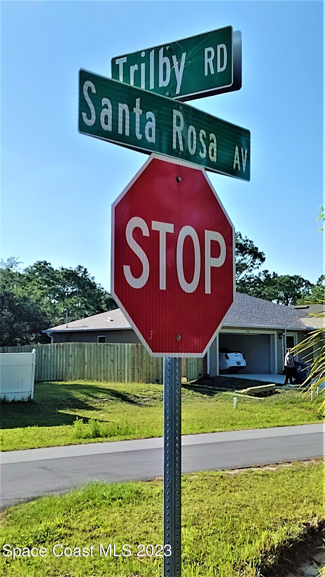 263 Trilby Road Southwest Palm Bay, FL 32908 - Photo 7 of 33 a street sign on a pole on a street