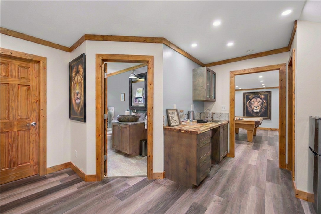 183 Little Eastatoee Road Sunset, SC 29685 - Photo 35 of 50 Recessed lighting illuminates this functional hallway, featuring a convenient bar area and access to a full bathroom.