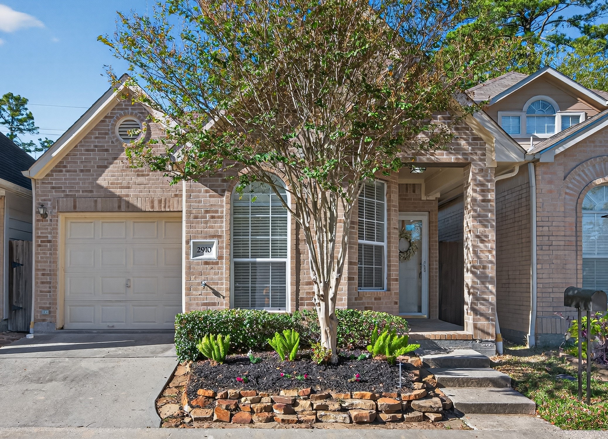 Super cute and easy to maintain, this home’s front features a manicured, low-upkeep landscape—perfect for stress-free curb appeal!