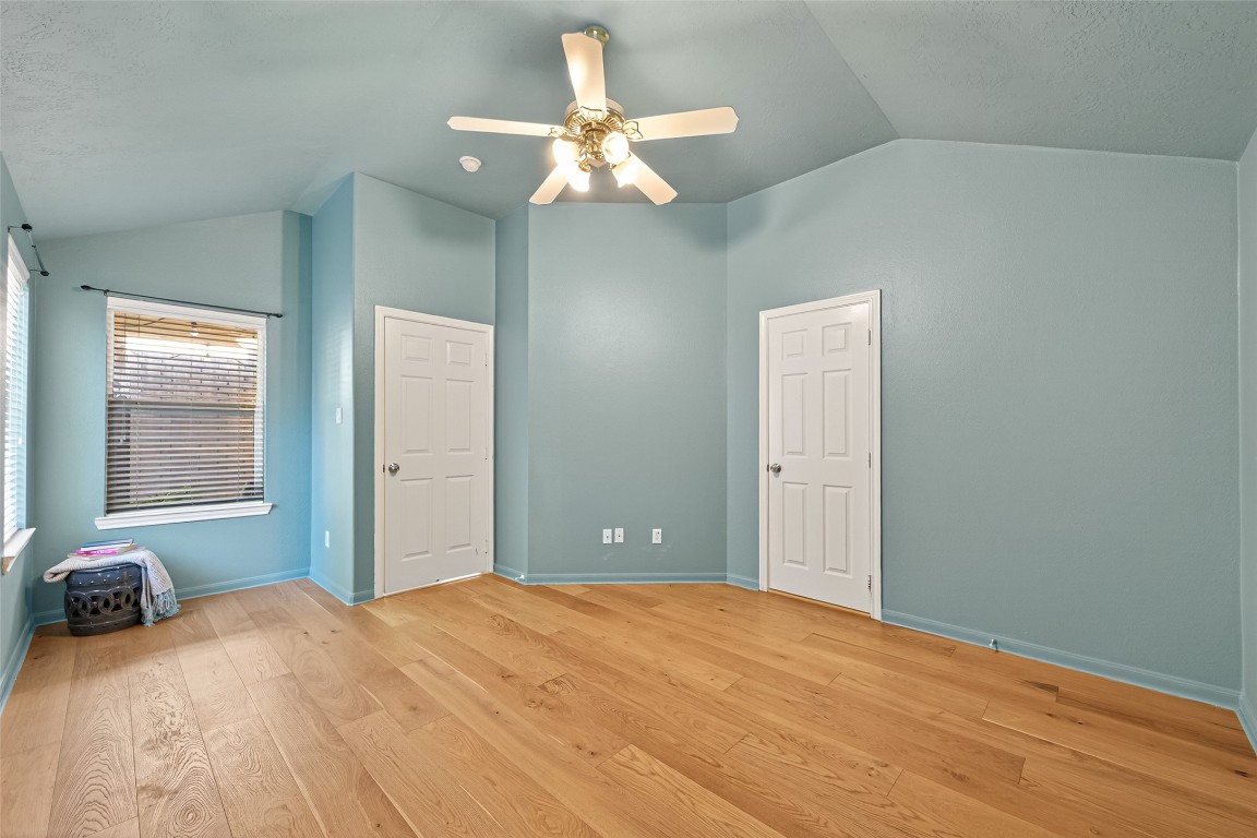 2910 Crescent Bend Road Spring, TX 77388 - Photo 11 of 35 The primary bedroom features a cozy, light-filled nook—an inviting spot for a desk or quiet reading corner.