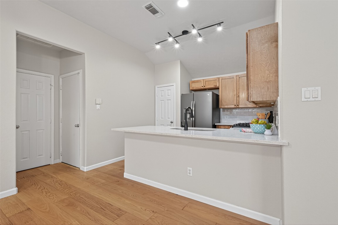 2910 Crescent Bend Road Spring, TX 77388 - Photo 25 of 35 Just steps from the kitchen, the laundry room offers effortless convenience with four cabinets, an included washer and dryer, and a nearby storage closet to keep essentials handy but tucked away.