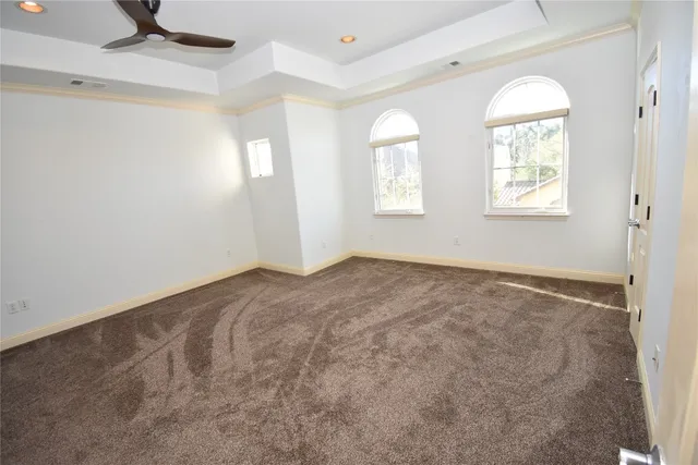 a view of empty room with windows