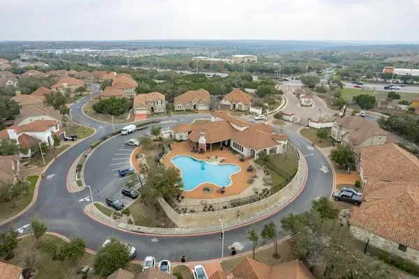an aerial view of a house with outdoor space