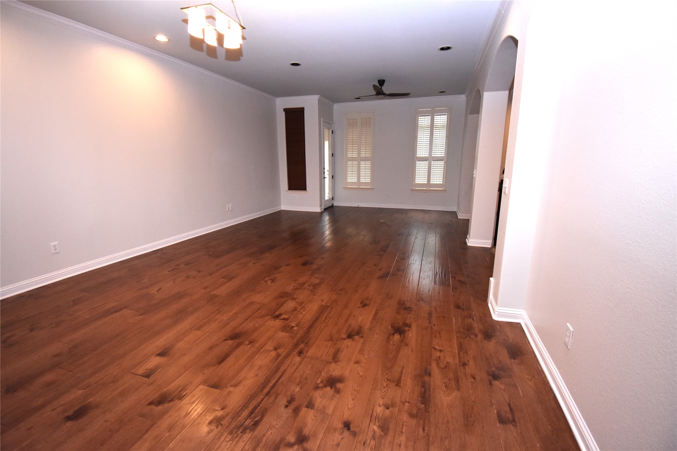 12105 Terraza Circle, Unit 67 Austin, TX 78726 - Photo 19 of 39 wooden floor in an empty room with a window