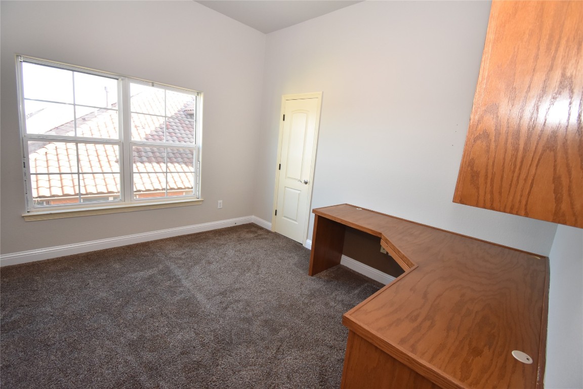 12105 Terraza Circle, Unit 67 Austin, TX 78726 - Photo 21 of 30 an empty room with windows