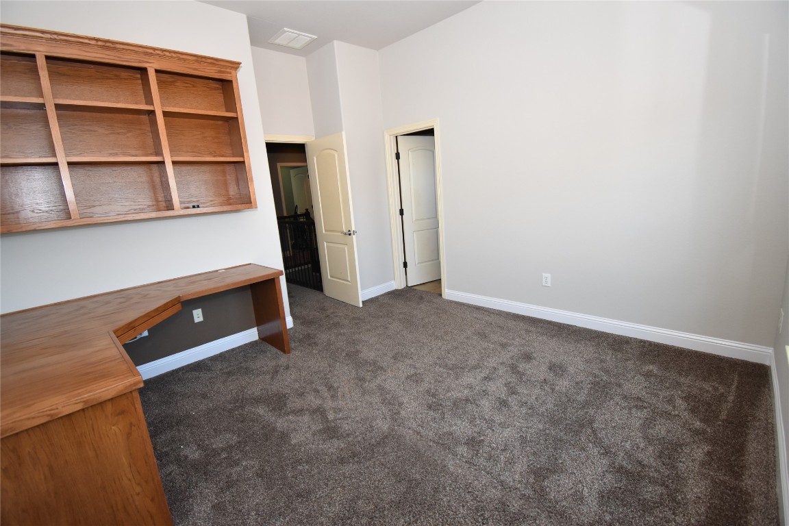 12105 Terraza Circle, Unit 67 Austin, TX 78726 - Photo 24 of 30 a room with a furniture and a window