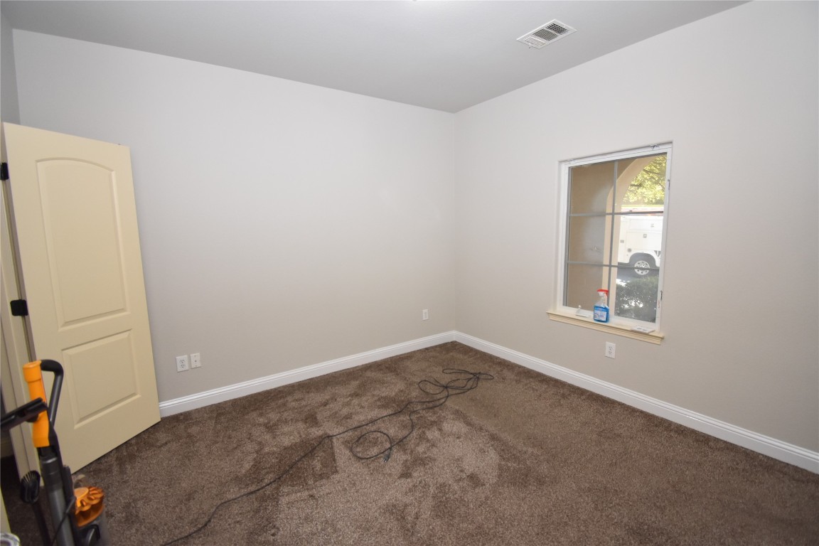 12105 Terraza Circle, Unit 67 Austin, TX 78726 - Photo 26 of 30 an empty room with a window