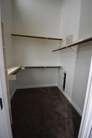 a spacious bathroom with a double vanity sink a mirror and a bathtub