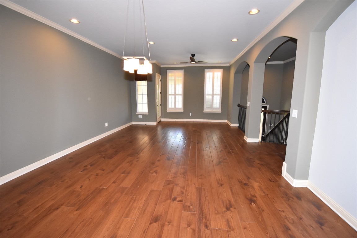 12105 Terraza Circle, Unit 67 Austin, TX 78726 - Photo 3 of 30 a view of an empty room with wooden floor and a window