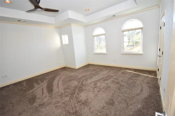 a view of empty room with windows