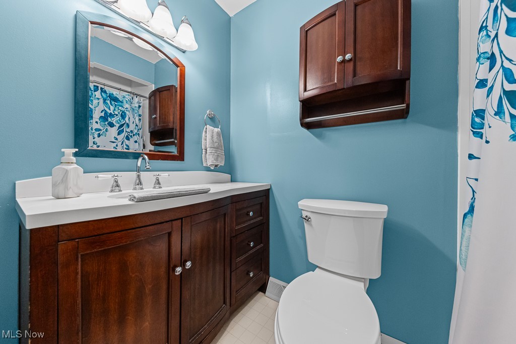 4000 Kenneth Road Stow, OH 44224 - Photo 22 of 50 Bathroom with vanity, tile patterned floors, and curtained shower