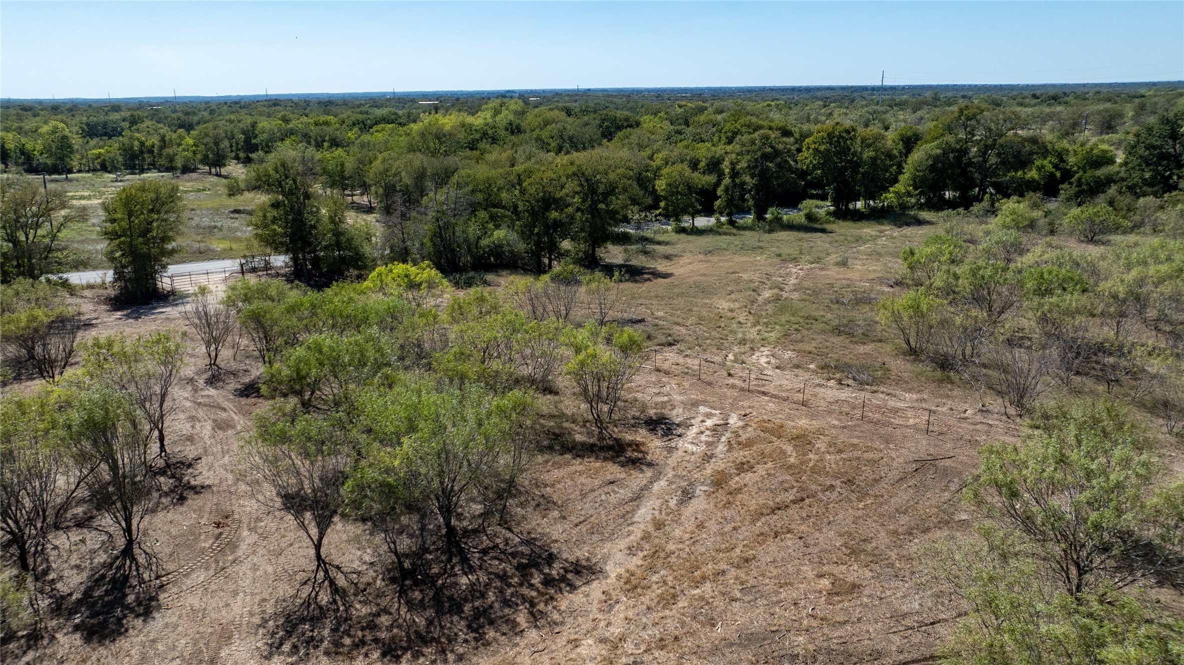 4005 Old Colony Line Road Dale, TX 78616 - Photo 1 of 8 a view of a yard with a street