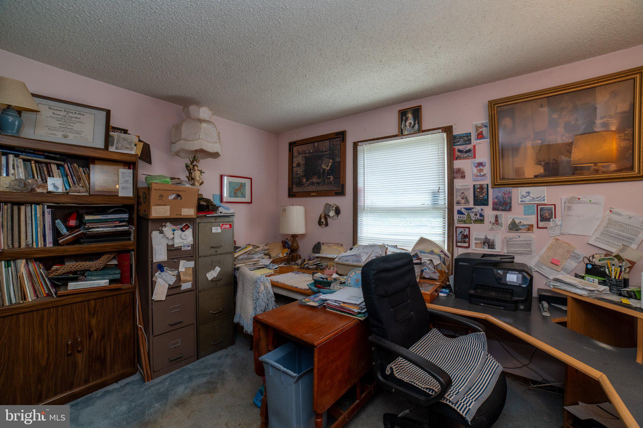 911 Monmouth Road New Egypt, NJ 08533 - Photo 19 of 19 Cluttered workspace brimming with memories.