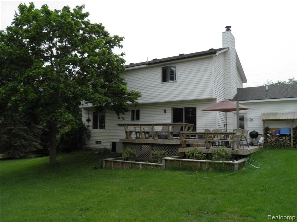 6060 Ford Road Commerce Township, MI 48382 - Photo 21 of 25 Exterior rear view of home