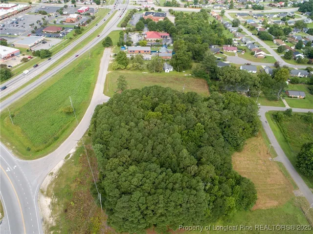a view of a swimming pool with a yard