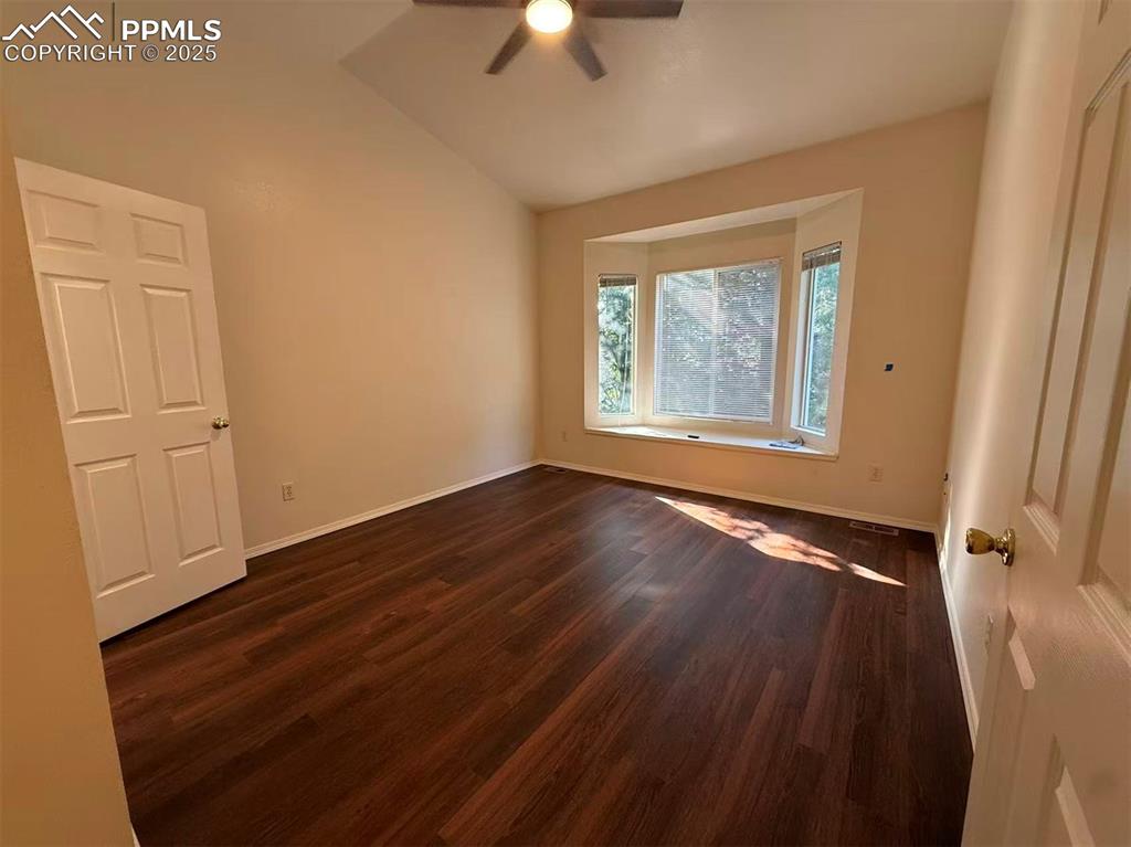 2095 Legacy Ridge View, Unit 102 Colorado Springs, CO 80910 - Photo 9 of 13 a view of an empty room with window and wooden floor
