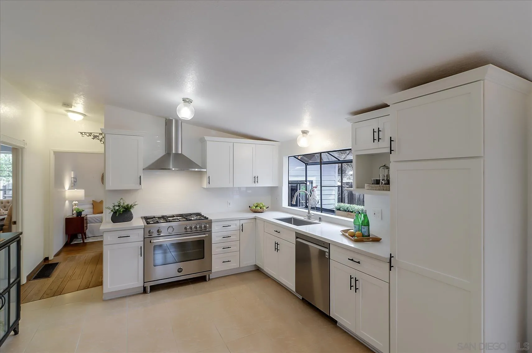 1521 D Street Hayward, CA 94541 - Photo 11 of 39 a kitchen with stainless steel appliances a refrigerator sink and white cabinets