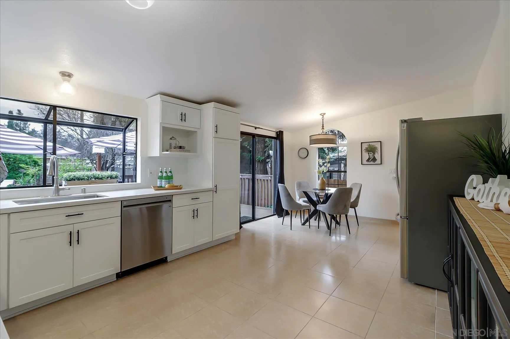 1521 D Street Hayward, CA 94541 - Photo 12 of 39 a kitchen with furniture a chandelier a stove a sink and a refrigerator
