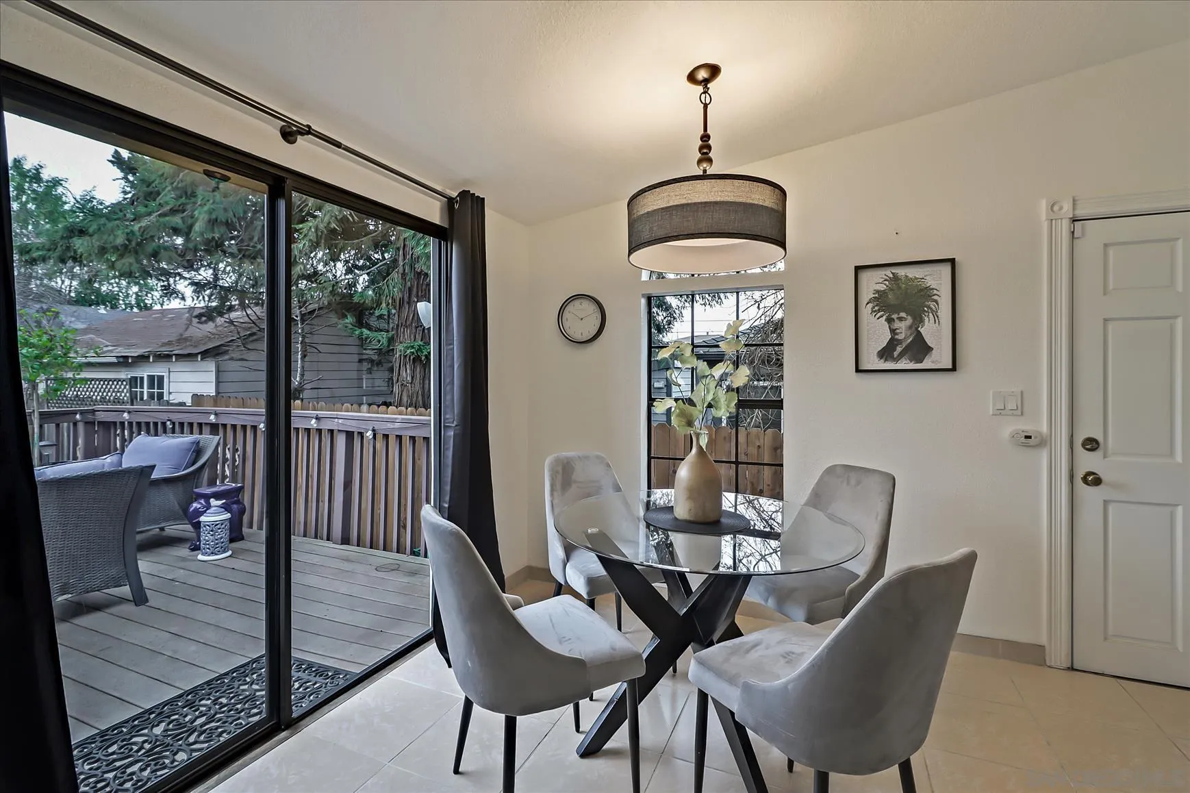 1521 D Street Hayward, CA 94541 - Photo 15 of 39 a dining room with furniture wooden floor a rug a potted plant and a chandelier