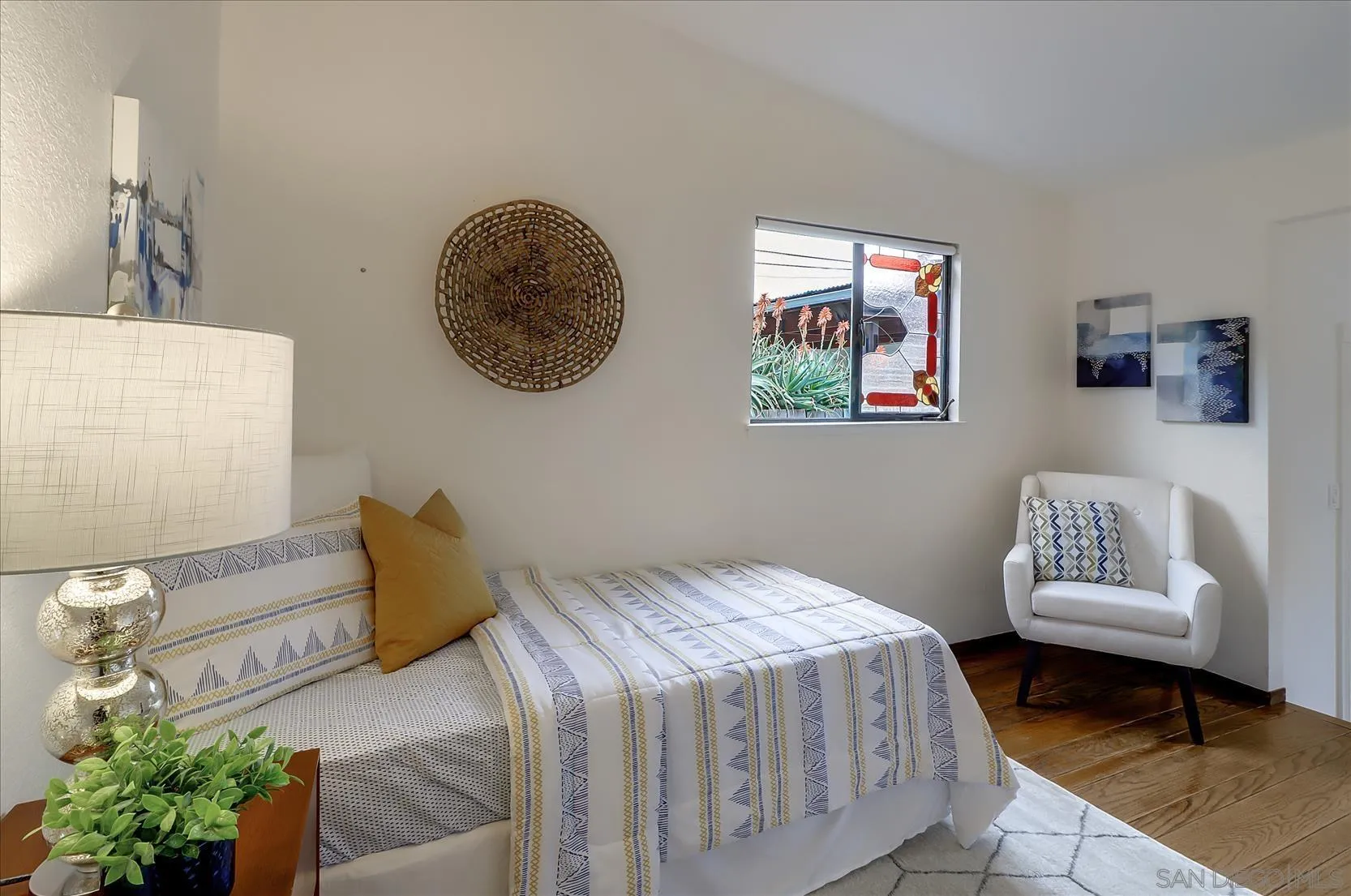 1521 D Street Hayward, CA 94541 - Photo 19 of 39 a bedroom with a bed and a painting on the wall