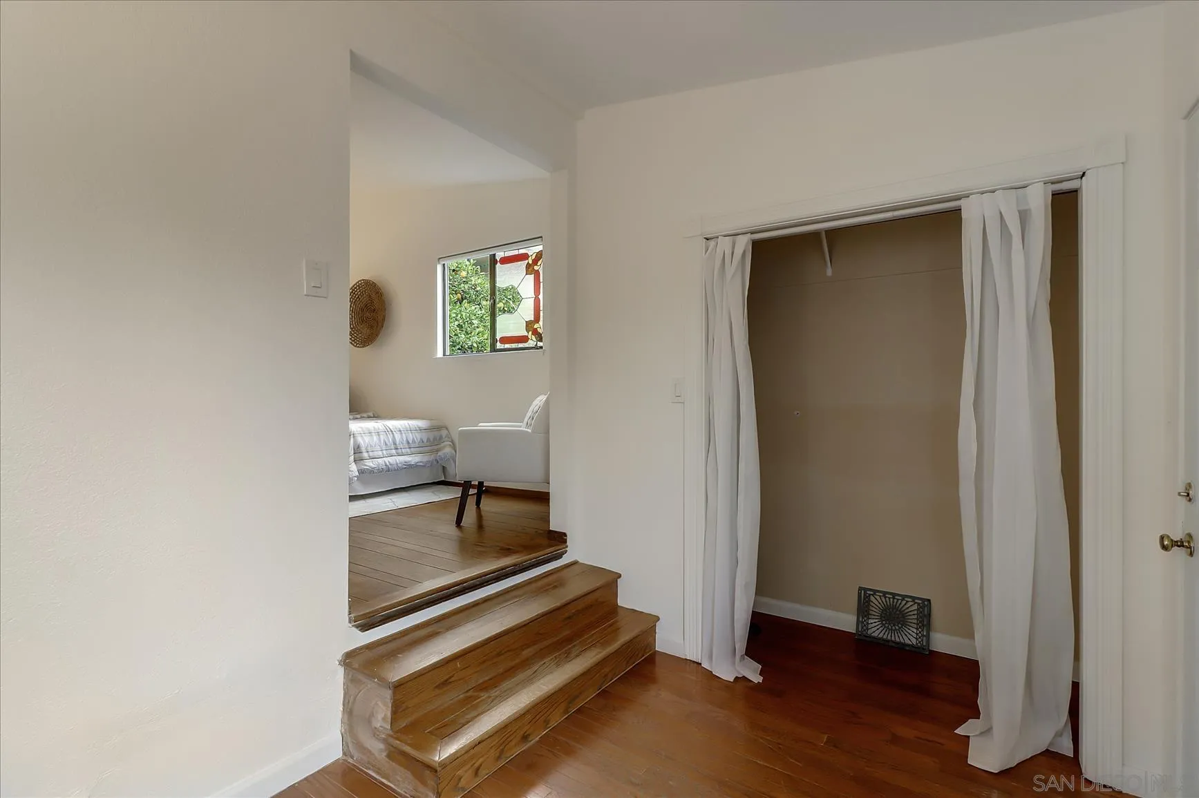 1521 D Street Hayward, CA 94541 - Photo 21 of 39 a view of a hallway with wooden floor and a bathroom