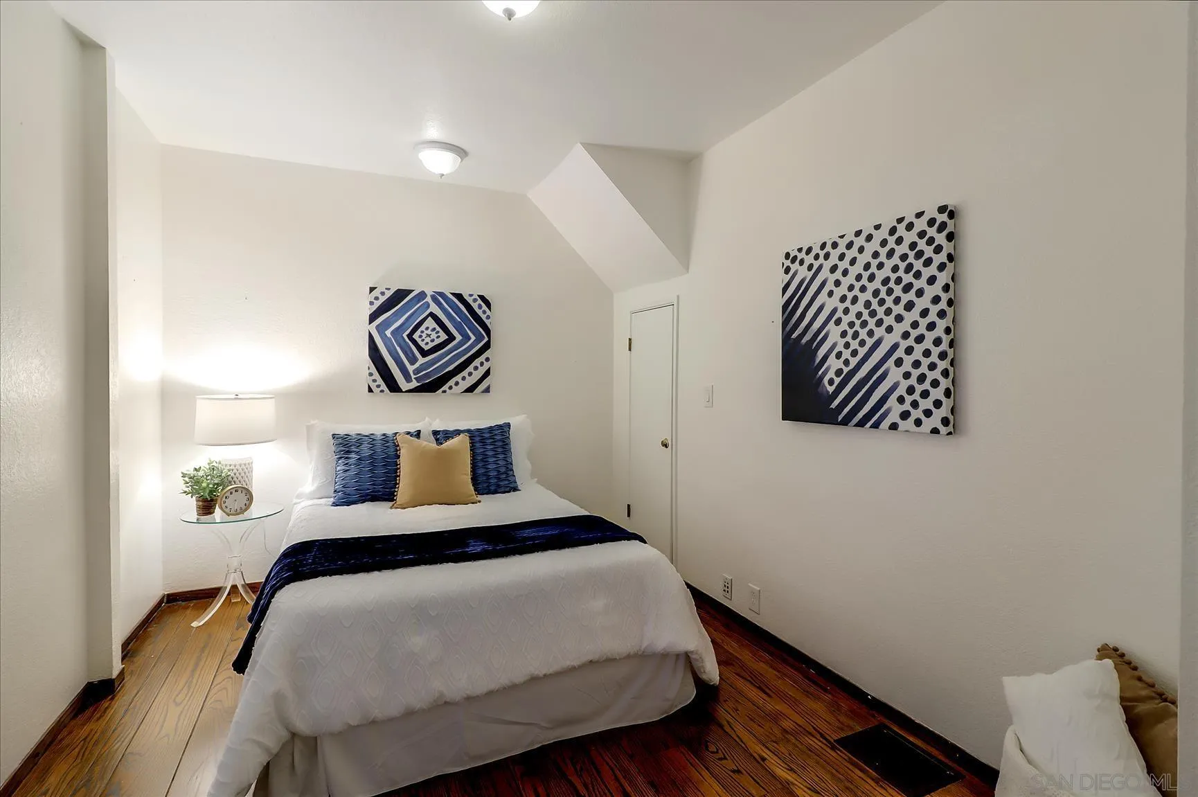 1521 D Street Hayward, CA 94541 - Photo 23 of 39 a bedroom with a bed and wooden floor