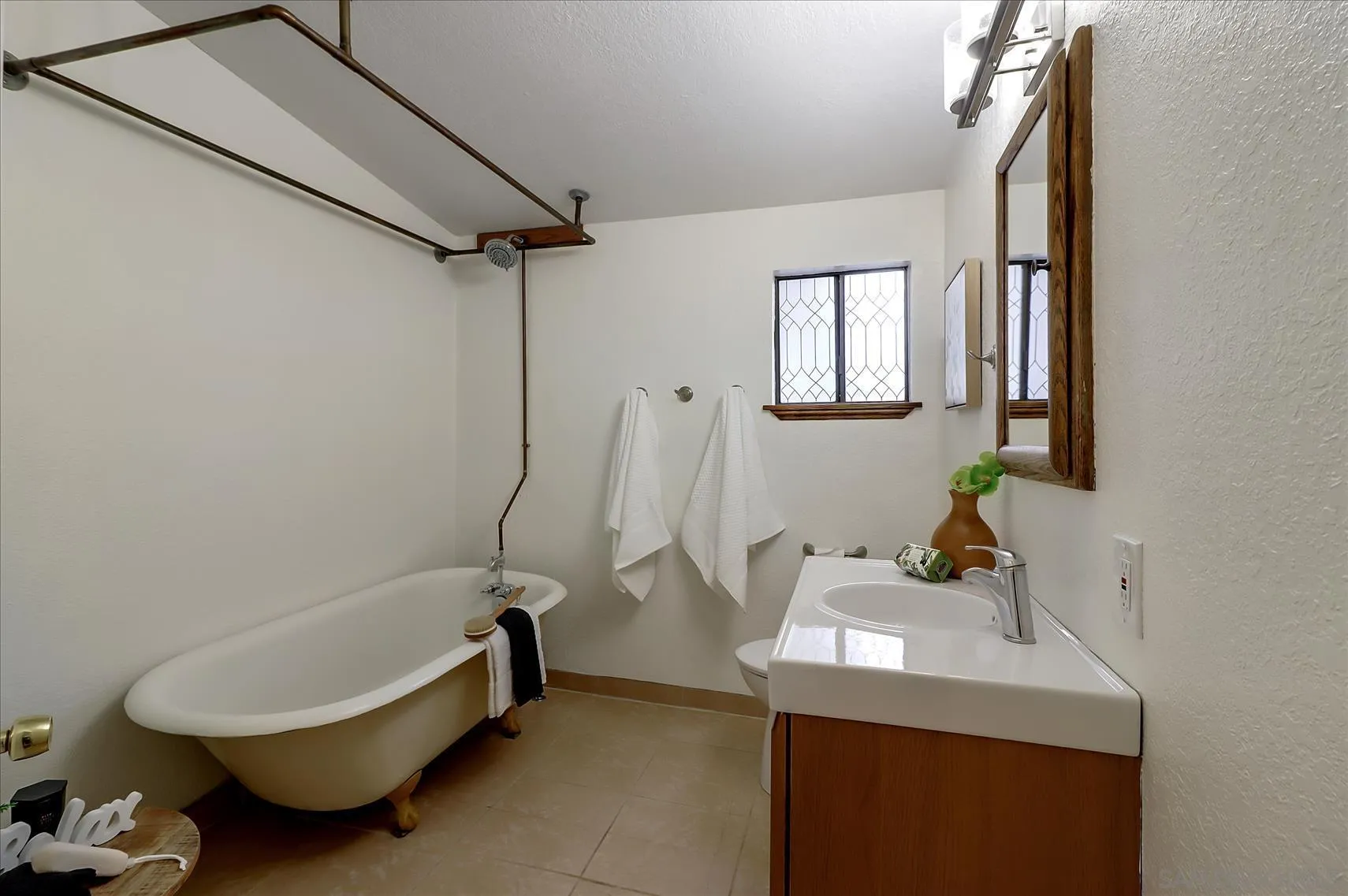 1521 D Street Hayward, CA 94541 - Photo 31 of 39 a bathroom with a sink a toilet and a tub