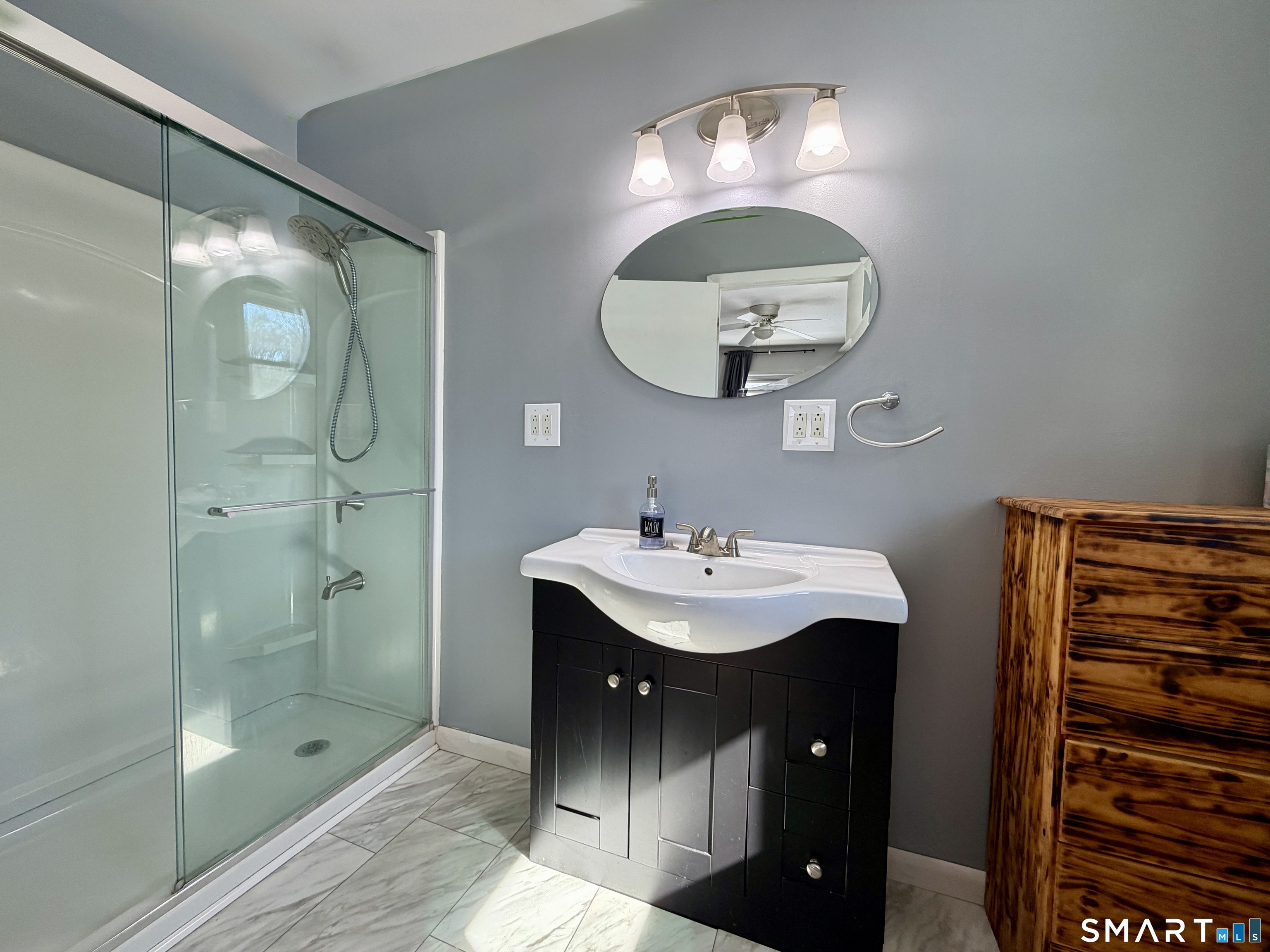 208 Gooseneck Hill Road Canterbury, CT 06331 - Photo 13 of 34 a bathroom with a sink a light fixture and a mirror