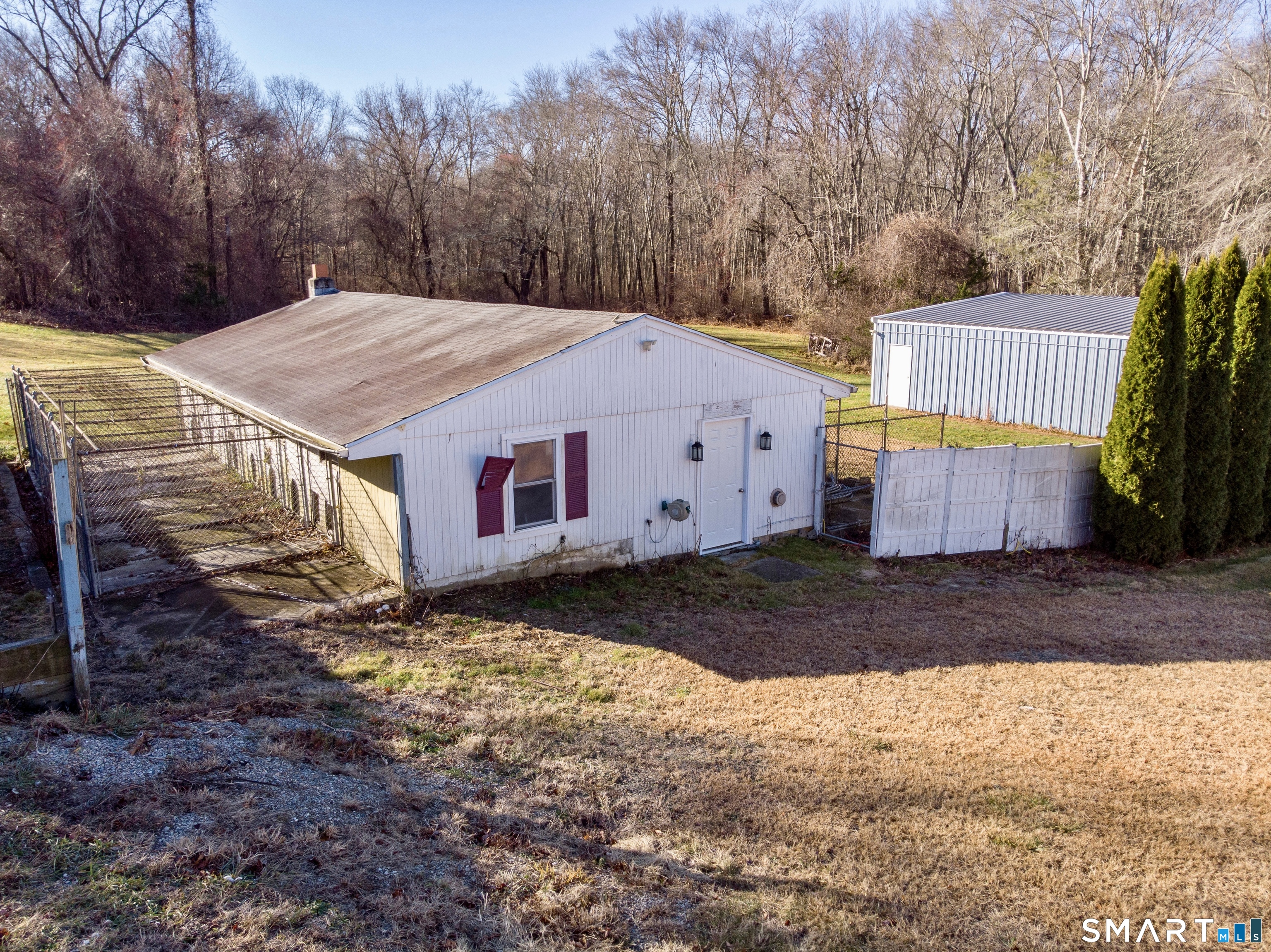208 Gooseneck Hill Road Canterbury, CT 06331 - Photo 26 of 34 a view of a large house with a yard covered in snow