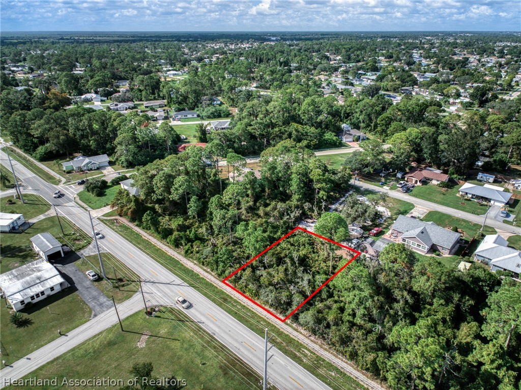 3308 Thunderbird Road Sebring, FL 33872 - Photo 2 of 6 an aerial view of residential house with outdoor space