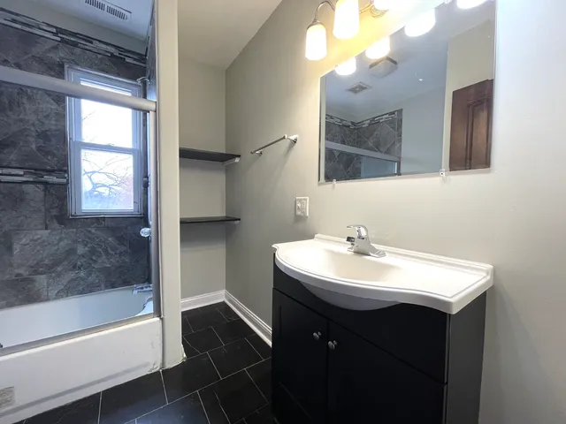 a bathroom with a sink a toilet and a bathtub