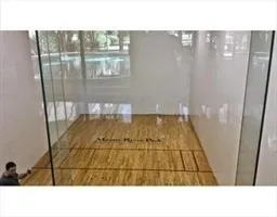 a bathroom with shower glass door and shower