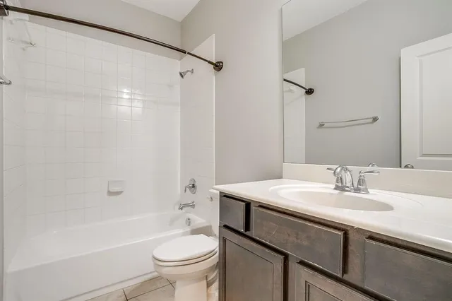 a bathroom with a sink a toilet and a bathtub