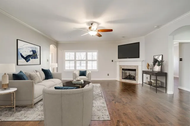 a living room with furniture fireplace and a flat screen tv