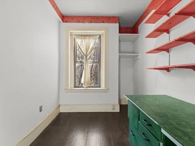a view of a utility room with closet and windows