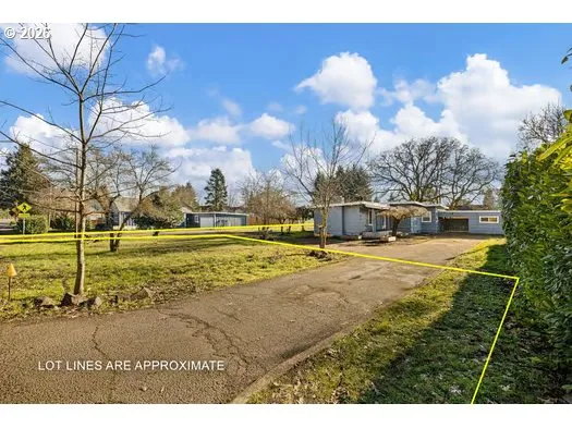 a view of a yard with swimming pool