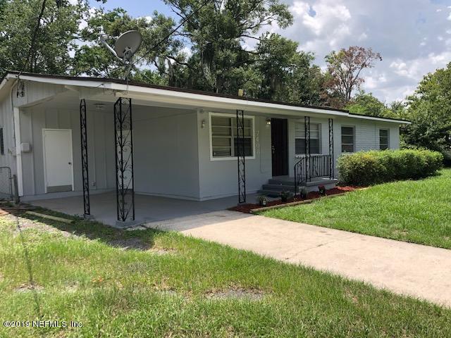 7408 Proxima Road Jacksonville, FL 32210 - Photo 1 of 10 a view of a house with yard and tree s