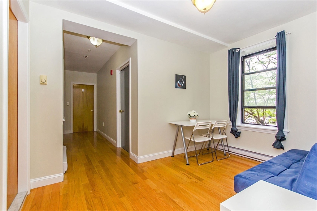 106 Tyler Street Boston, MA 02111 - Photo 12 of 16 a work room with furniture and window