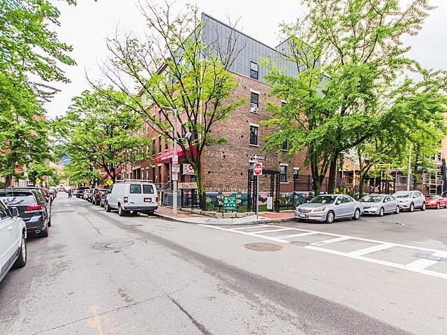 106 Tyler Street Boston, MA 02111 - Photo 2 of 16 a view of a cars parked on the side of a street