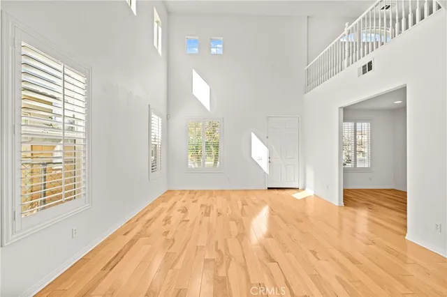 a view of a workspace with furniture and a bookshelf