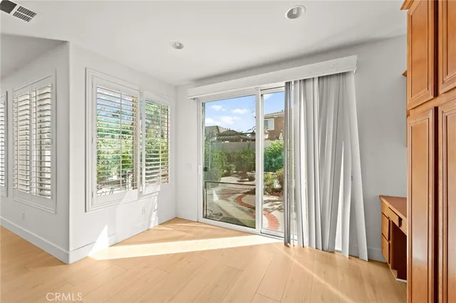 a living room with furniture fireplace and window