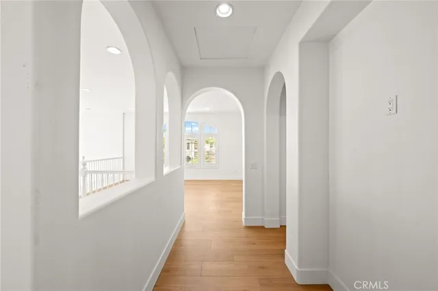 a bathroom with a double vanity sink a mirror and a bathtub
