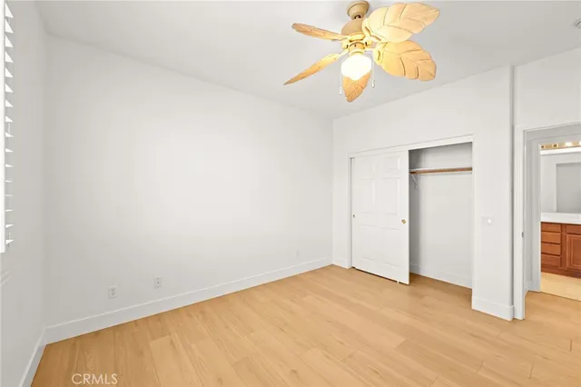 a spacious bathroom with a tub sink and mirror