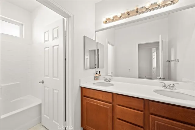 a white bath tub sitting next to a window