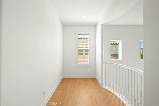 a spacious bathroom with a granite countertop sink and a mirror