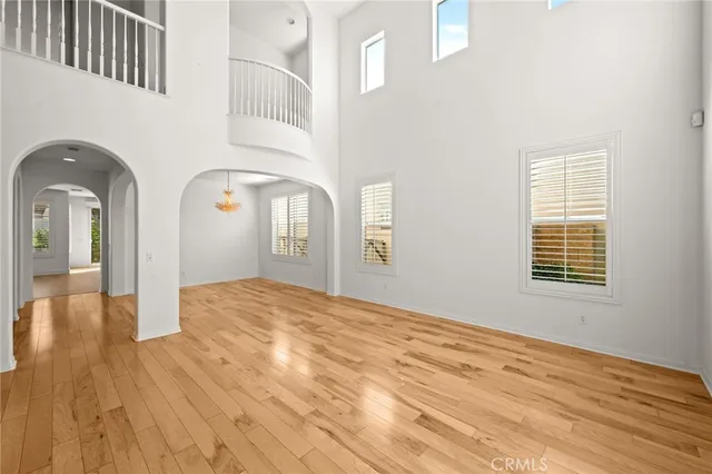 a living room with furniture wooden floor and a flat screen tv