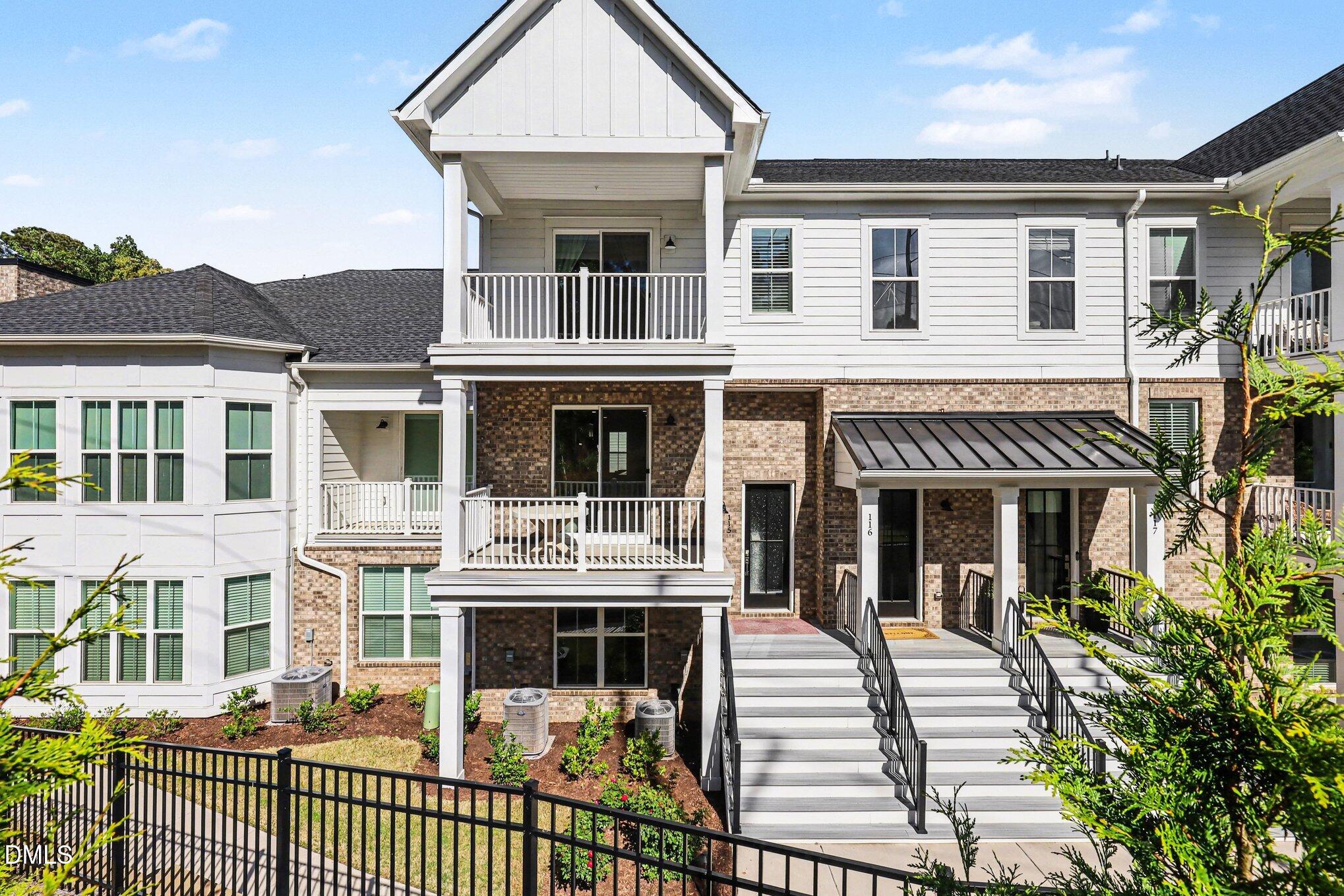 11549 Helmond Way, Unit 115 Raleigh, NC 27617 - Photo 1 of 25 a front view of a house with a porch