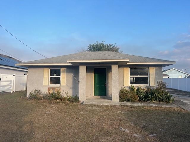 front view of a house with a yard